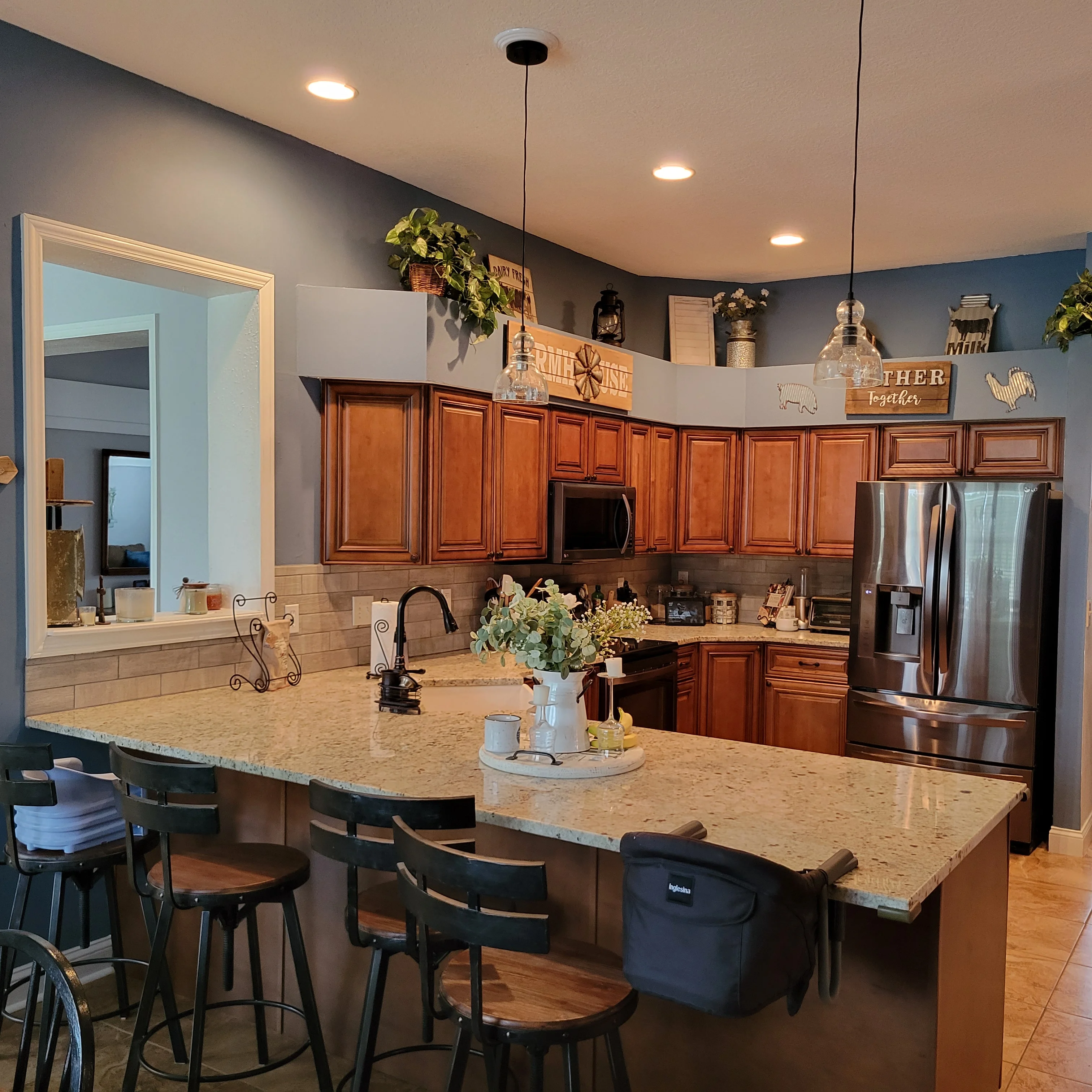 Cherry wood cabinetry, granite countertops, stainless steel appliances, subway tile backsplash, recessed lighting